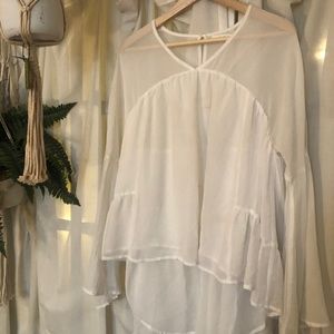 Asymmetrical White blouse with bell sleeves